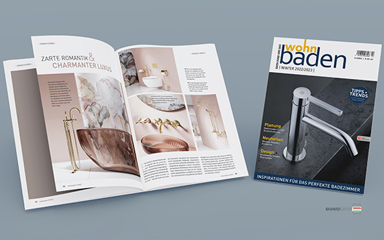 Mockup illustration, cover picture of the trend magazine “wohnbaden” winter 2022/2023 and attractively illustrated article featuring the “La vie en rose” bathroom design by Jörger Design with “Cronos” fittings and accessories in exclusive sunshine finish.