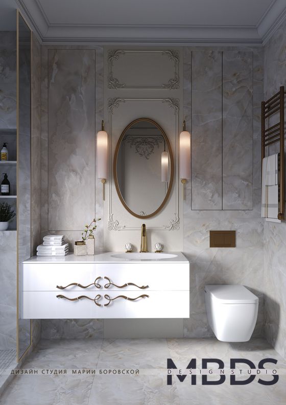 Jörger Design Waschtischarmatur Belledor in Edelmessing matt mit Griffen aus weißem, goldbemalten Porzellan in einem Badinterieur im Stil des Art déco
